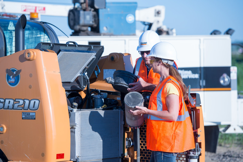 The Eagle service team servicing a Case skid steer