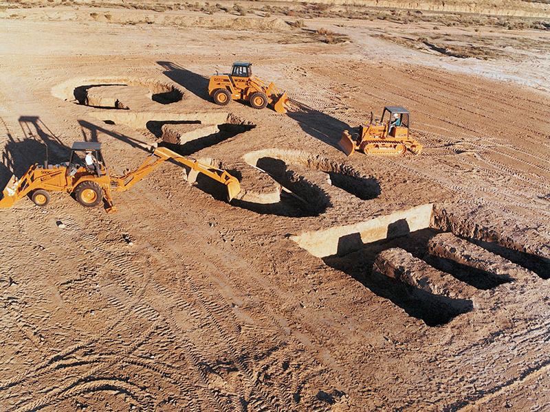 CASE written in dirt by 3 CASE tractors